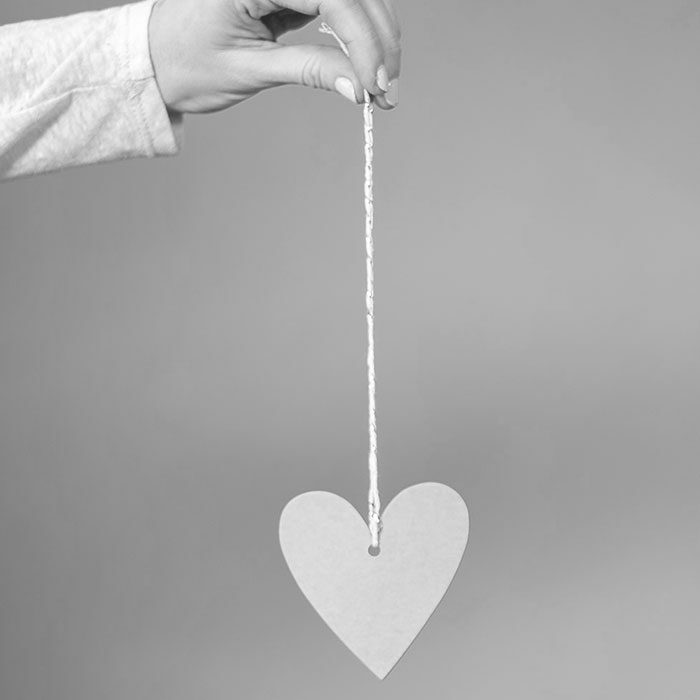 Hand holding paper heart
